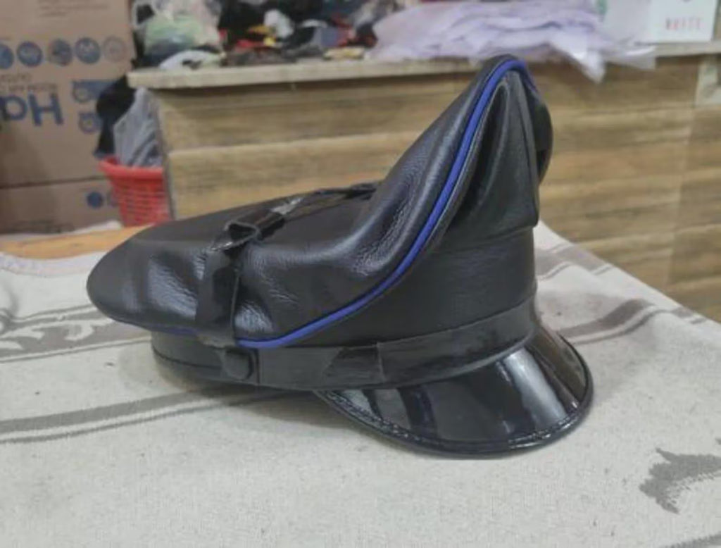 men's black leather biker hat with blue piping three-quarter view