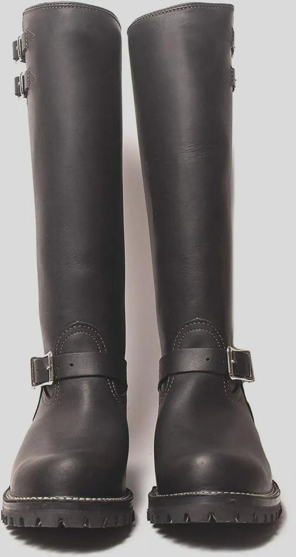 Pair of black knee-high Double Strap Leather Biker Boots front-view with buckles on a light gray background 