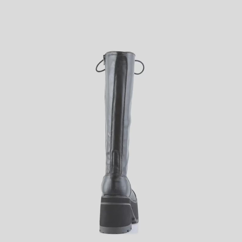 Black leather Knee-High Lace-Up Goth Boots on a light gray background
