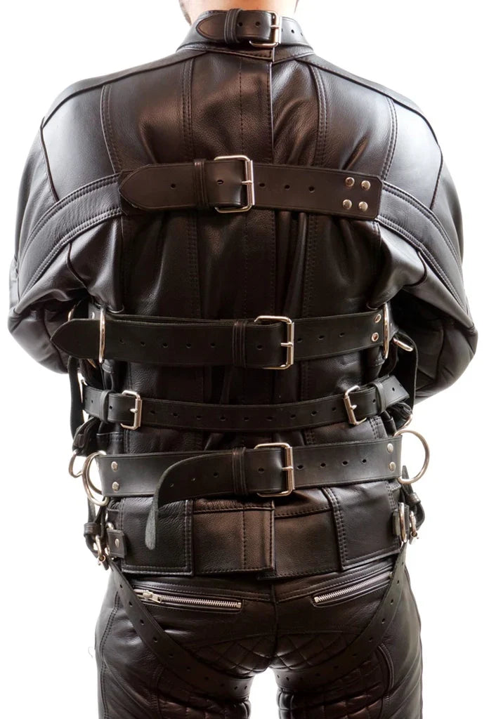 Black leather harness worn by a person on a white background