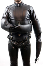 Black leather outfit with intricate detailing on a white background