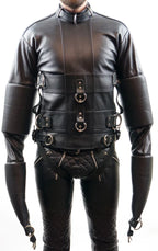 Black leather harness with intricate detailing on a white background