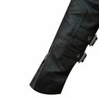 Close-up of a black leather jacket with zippers and buttons on a white background
