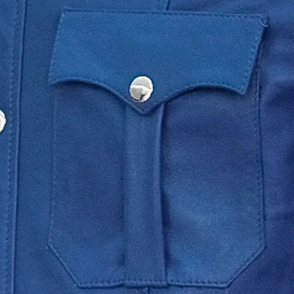 Close-up of a blue pocket with a button on a garment