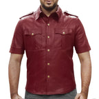Man wearing a red leather shirt with short sleeves on a white background