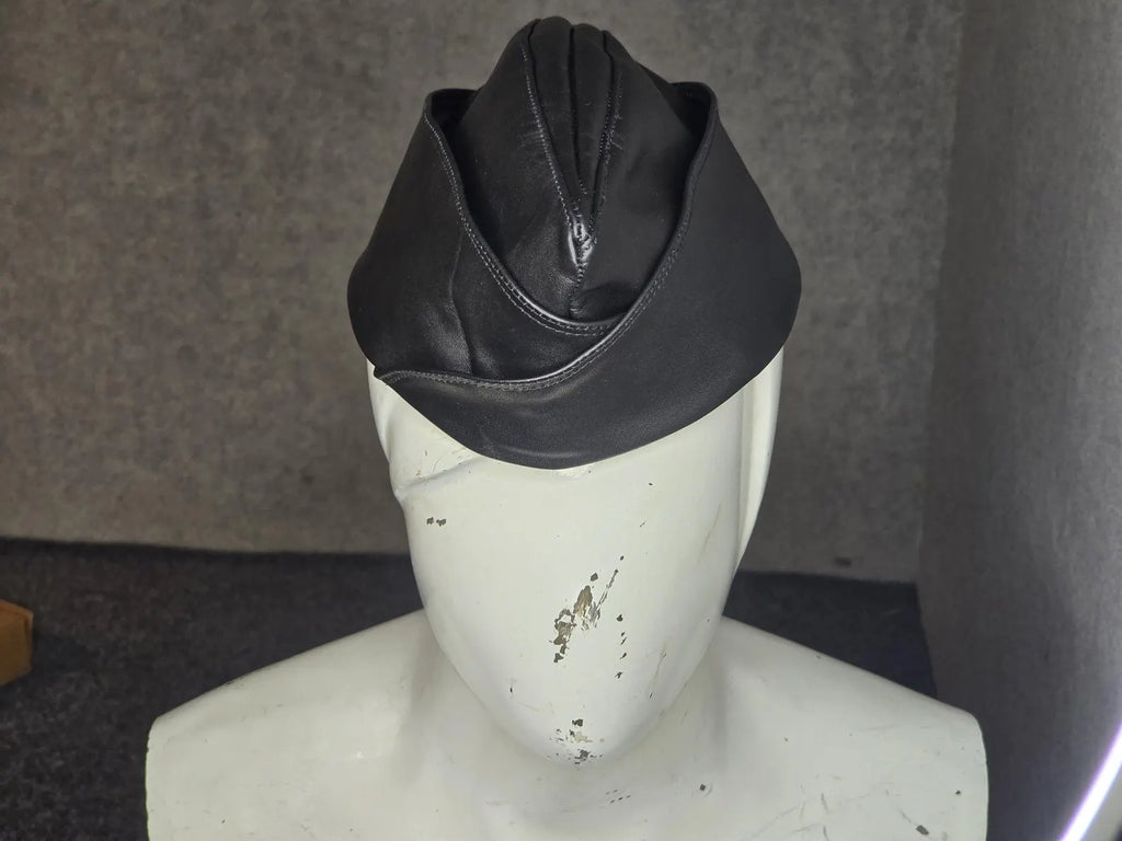 leather garrison cap side profile showing flat-folded crown detail