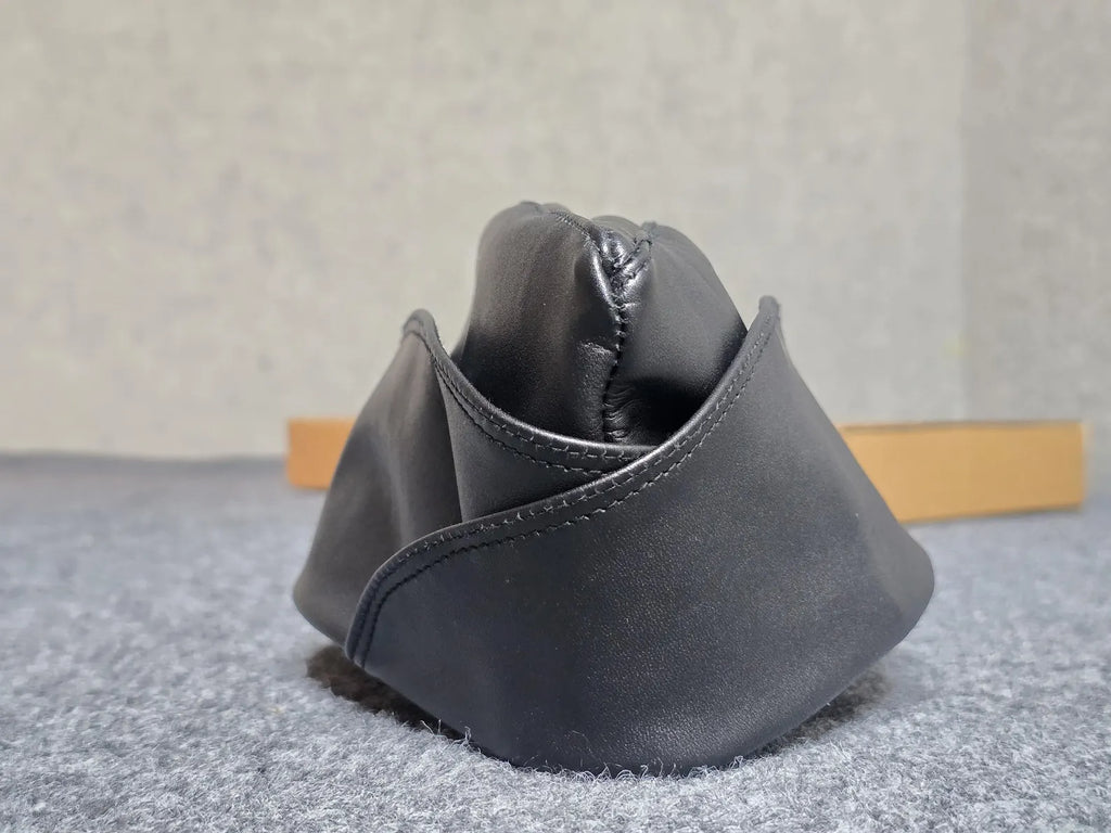 leather garrison cap side profile showing flat-folded crown detail