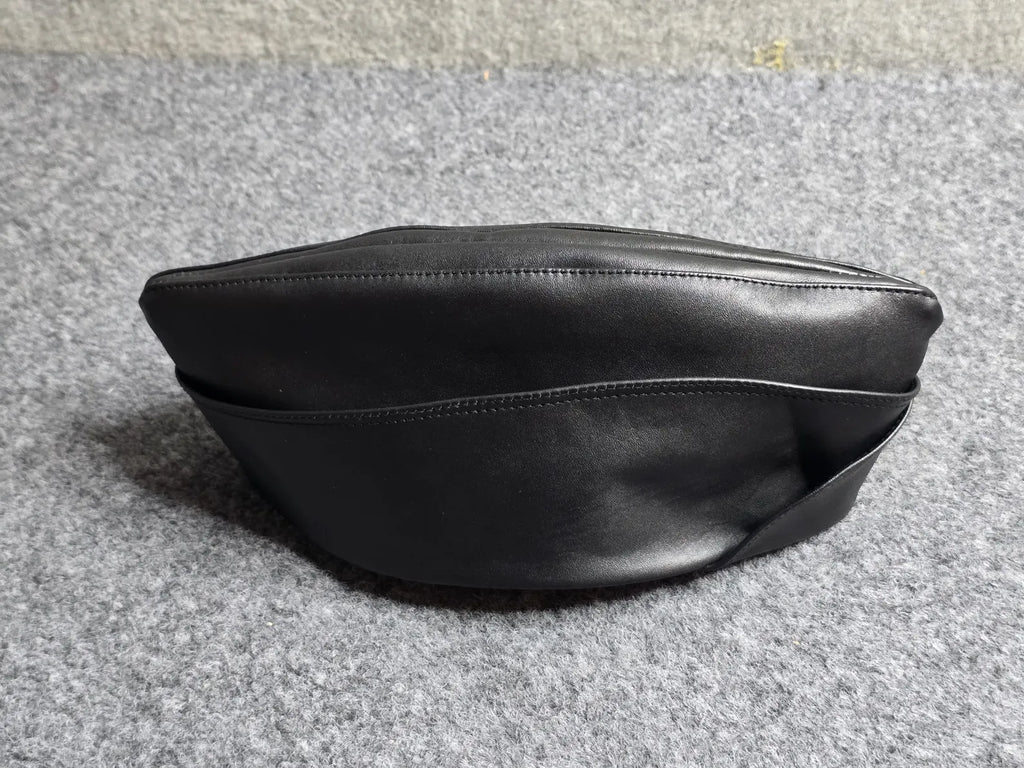 retro leather military garrison cap three-quarter view, structured silhouette